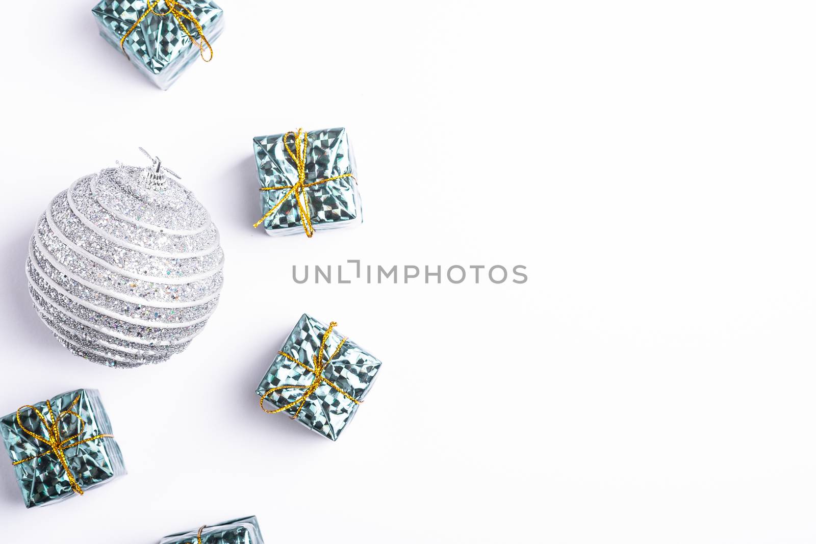 Christmas New Year composition. Gifts, silver ball decorations on white background. Winter holidays concept. Flat lay, top view, copy space