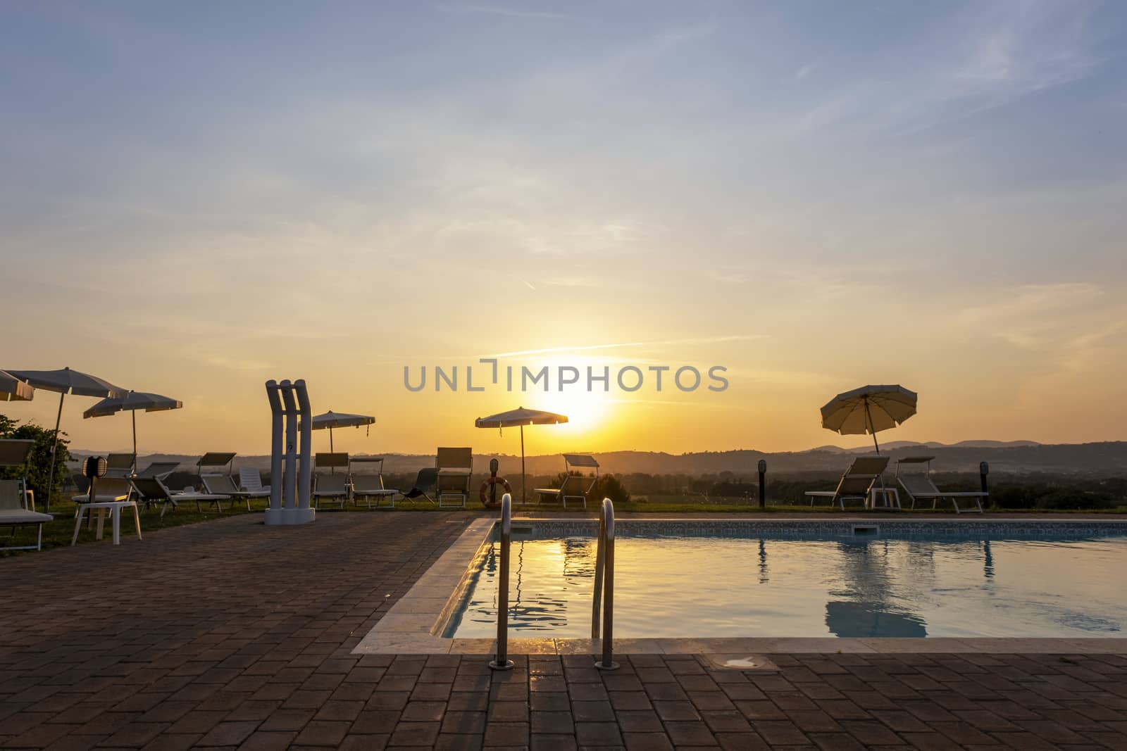 Outdoors sunset swimmingpool. Tropical resort hotel by Tjeerdkruse