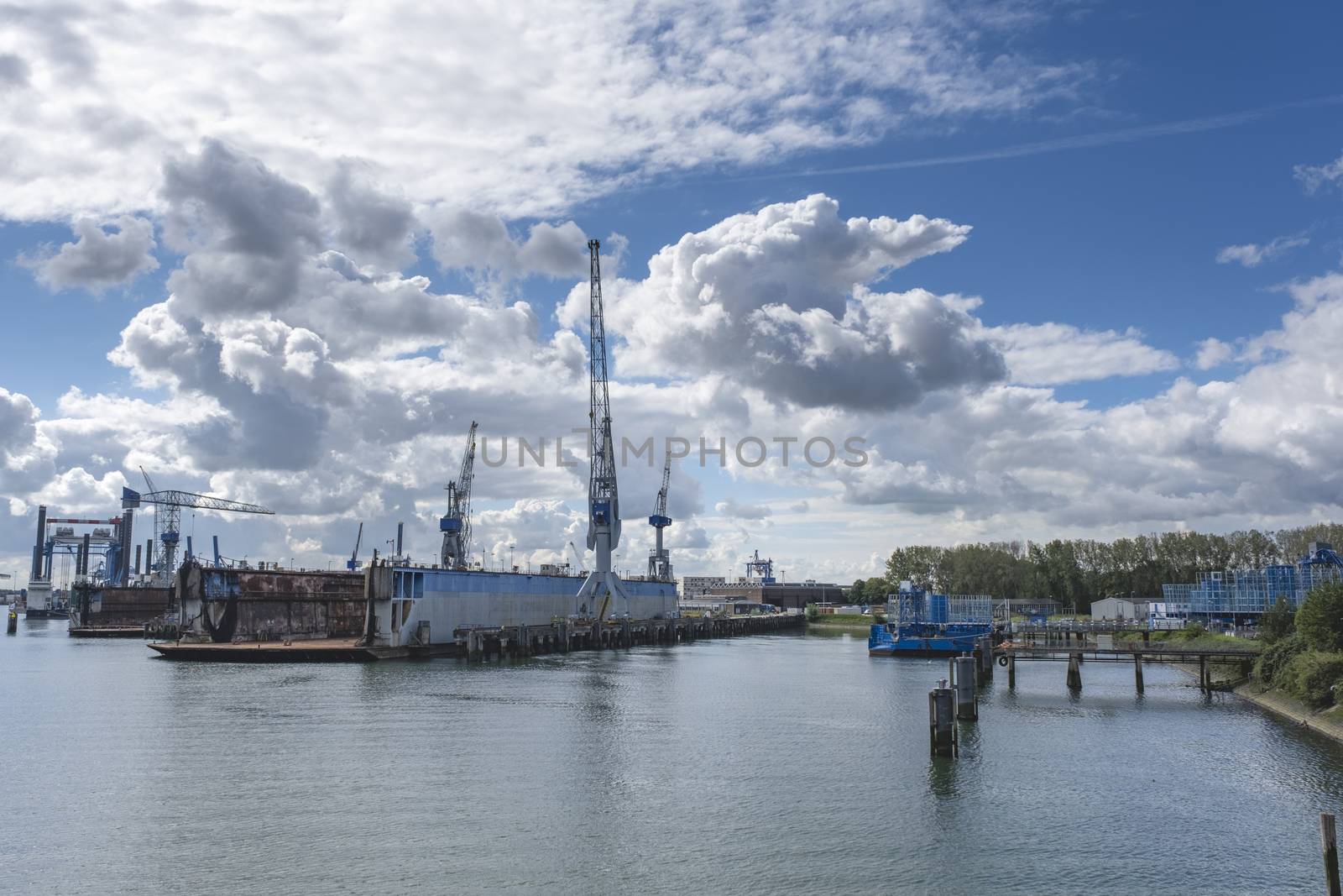 Harbor with large cranes and containers in Rotterdam, the Netherlands