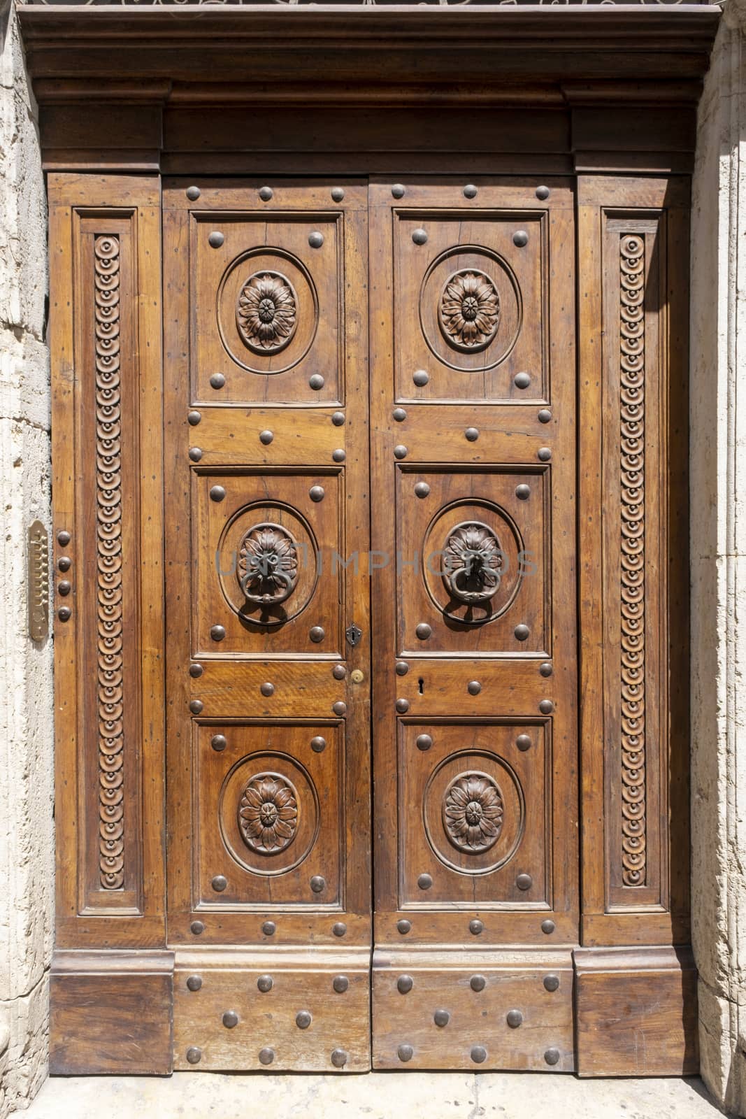 Old wooden door with ornaments by Tjeerdkruse