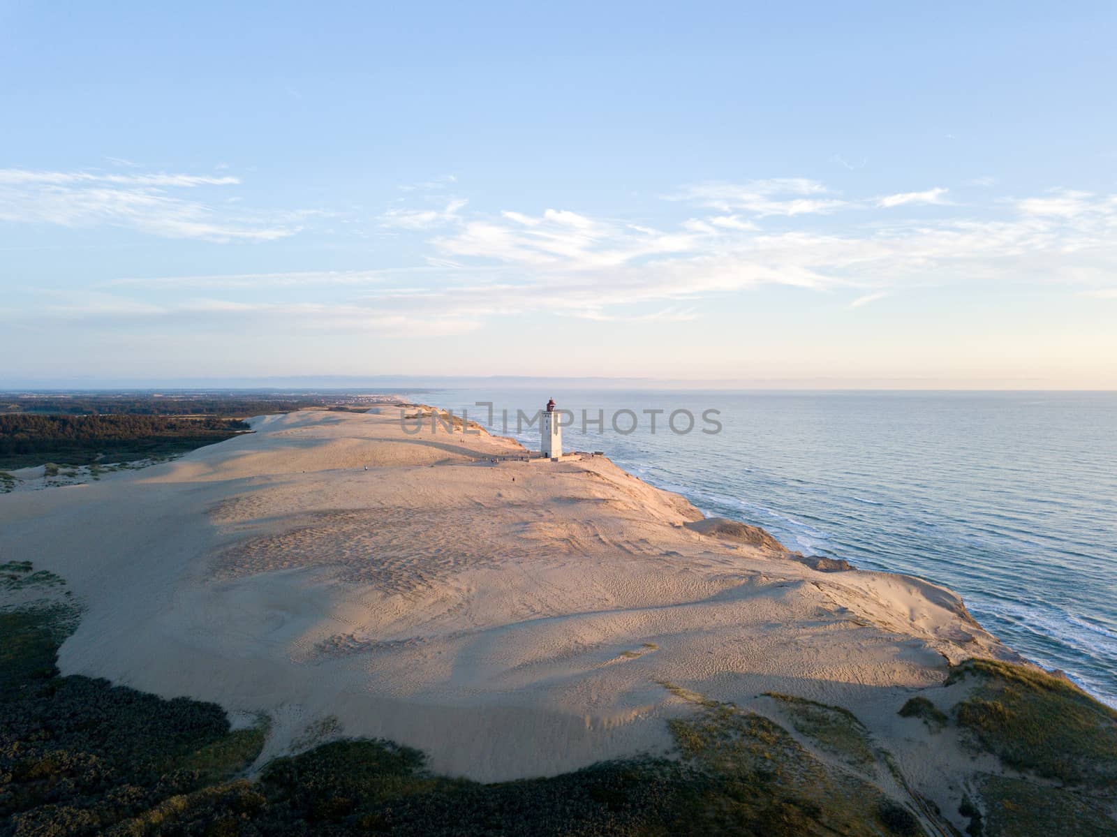 Aerial Drone View of Rubjerg Knude Lighthouse in Denmark by oliverfoerstner