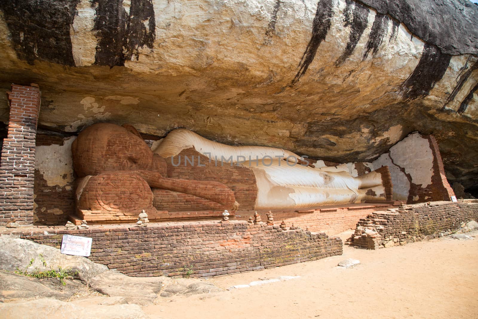 Sigiriya, Sri Lanka - August 17, 2018: A reclining buddha statue at Piduranagala Rock