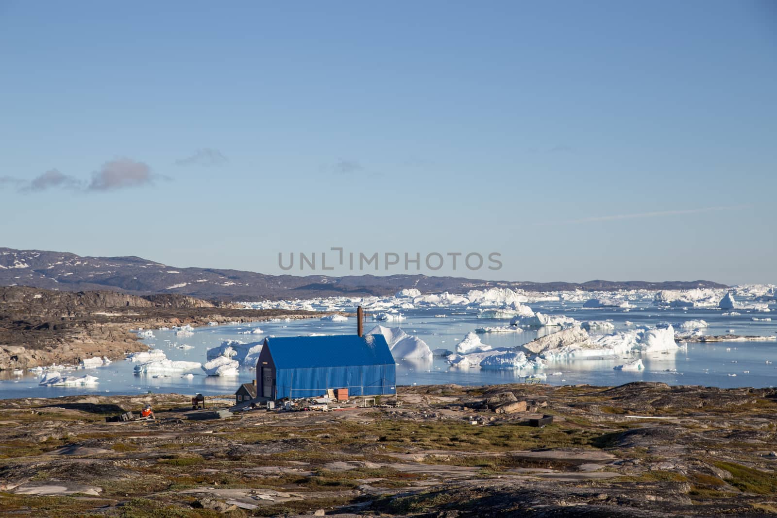 Rodebay, Greenland - July 09, 2018: The local waste incineration plant. Rodebay, also known as Oqaatsut is a fishing settlement north of Ilulissat.