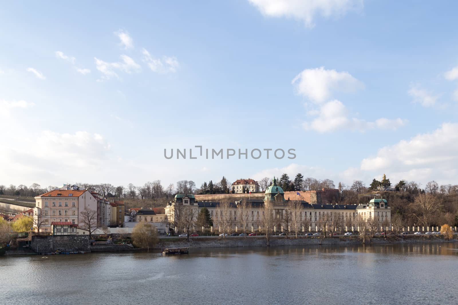 Prague, Czech Republic - March 15, 2017: View over Vltava River with Straka Academy, the seat of the government