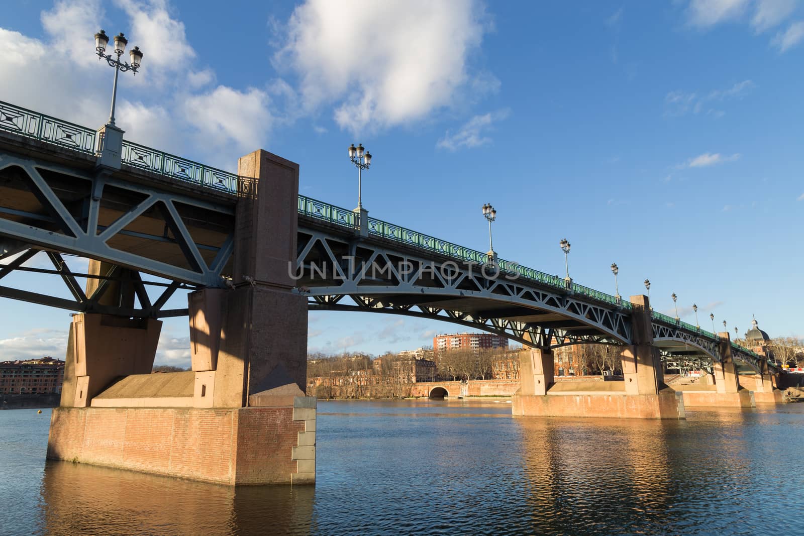 Photograph of the Garonne River and bridge Saint-Pierre in Toulouse, France.