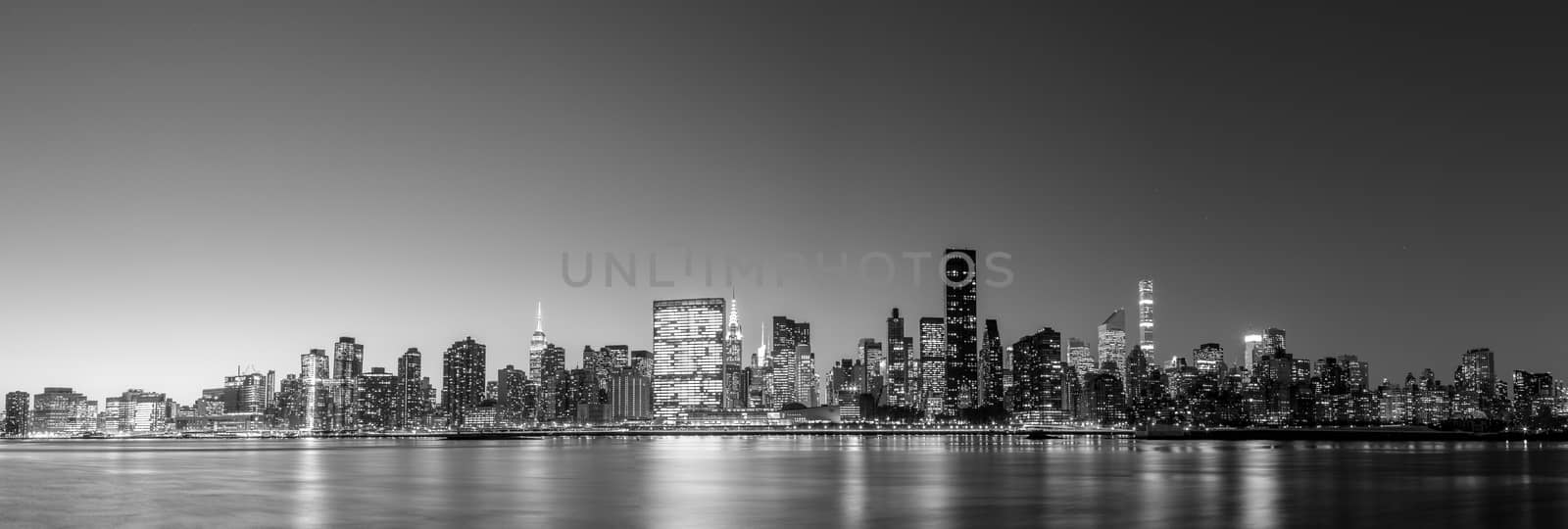 Black and white panoramic view of the skyline of midtown Manhattan in New York by night
