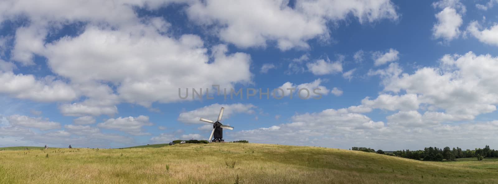 Hoejerg, Denmark - June 19, 2016: Panoramic landscape view of Historic Danish windmill called Pibe Moelle