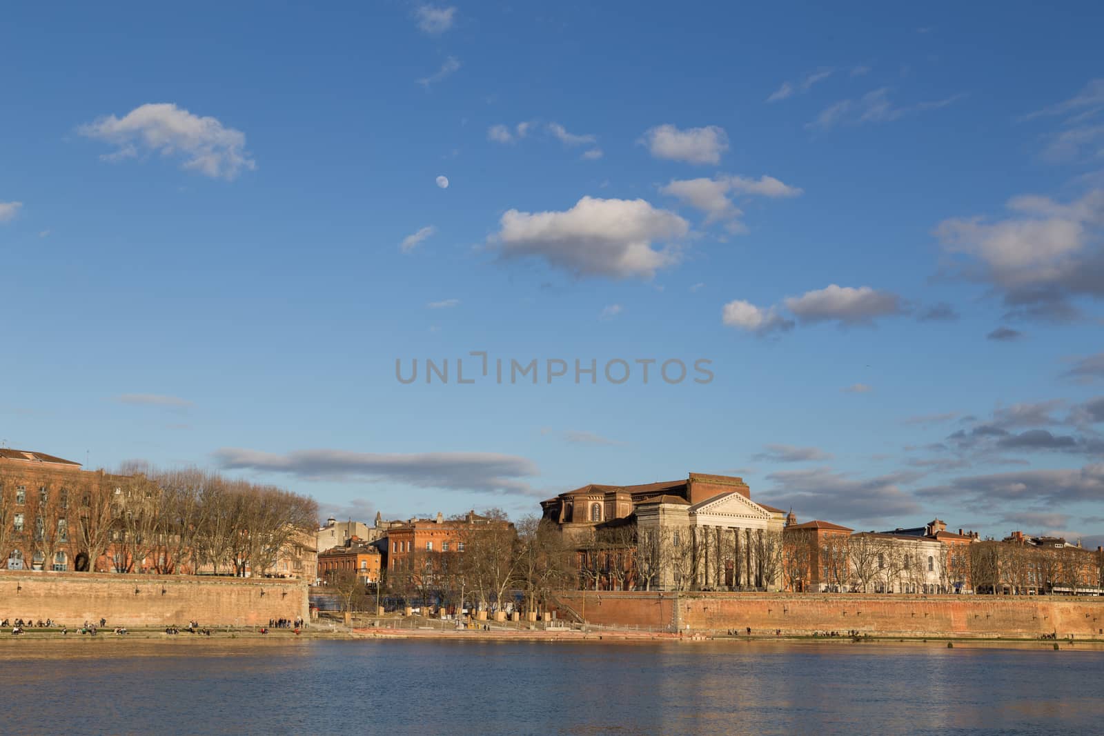 View over Garonne River in Toulouse in France with the Daurade church.