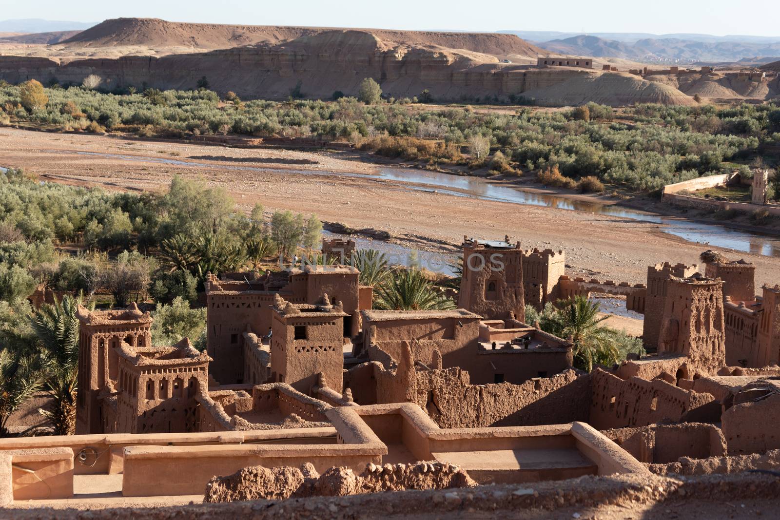 Ait Ben Haddou ksar Morocco, ancient fortress that is a Unesco Heritage site. Beautiful late afternoon light with honey, gold coloured mud brick construction the kasbah, or fortified town dates from 11th cent. and is on the former caravan route from the Sahara and Marrakech. The location has been used for many famous movies. High quality photo