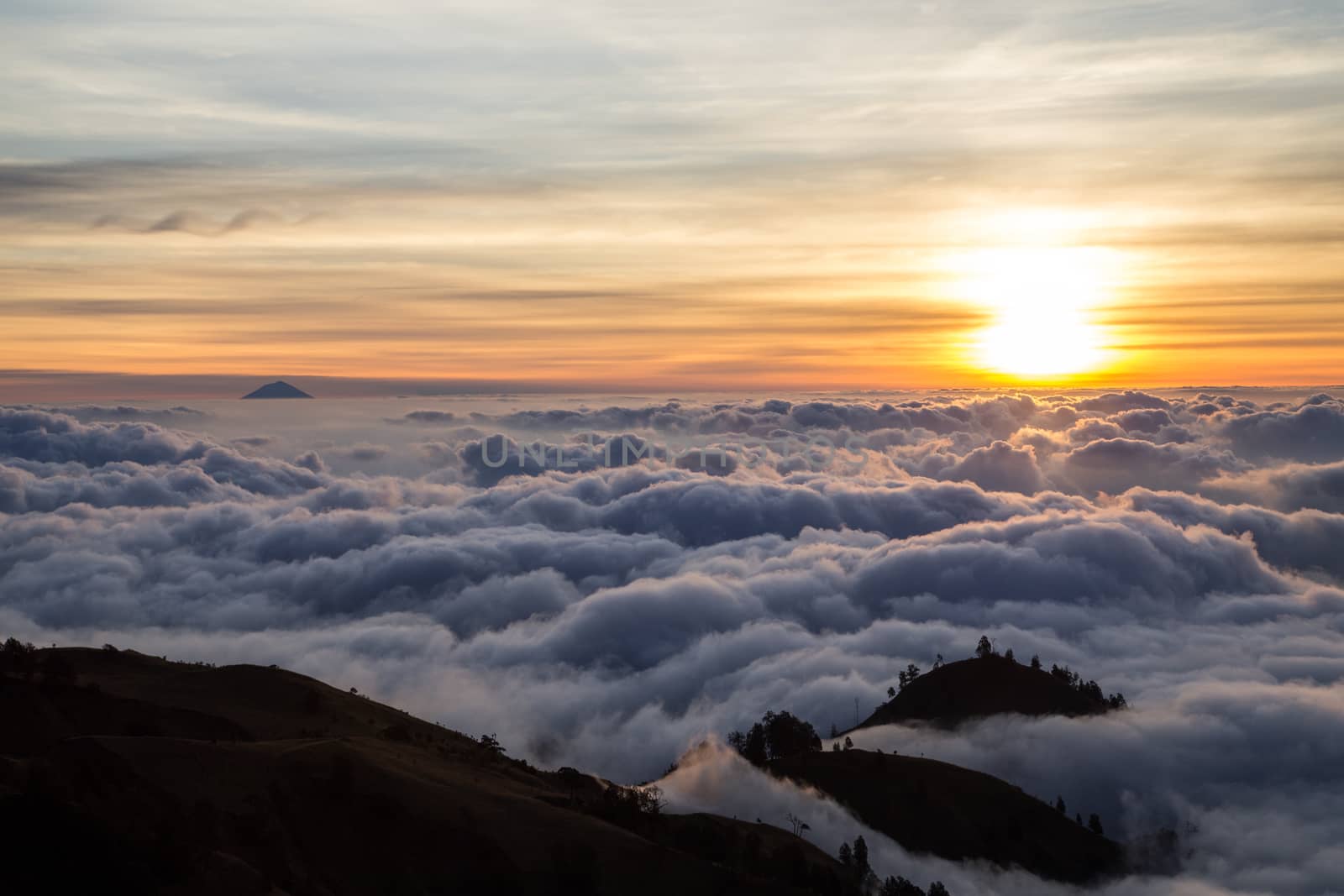 Sunset over clouds from Mount Rinjani on Lombok in Indonesia