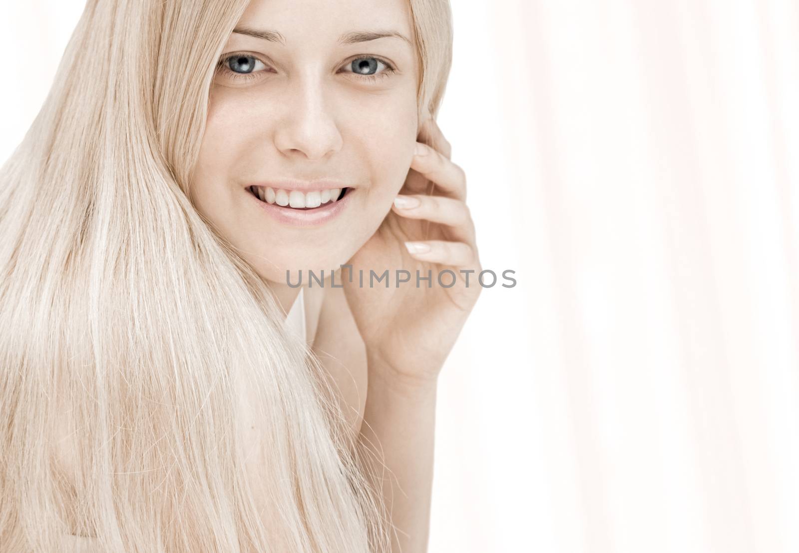 Beauty face close-up of young woman, blonde hair and chic make-up for skincare and haircare brand by Anneleven