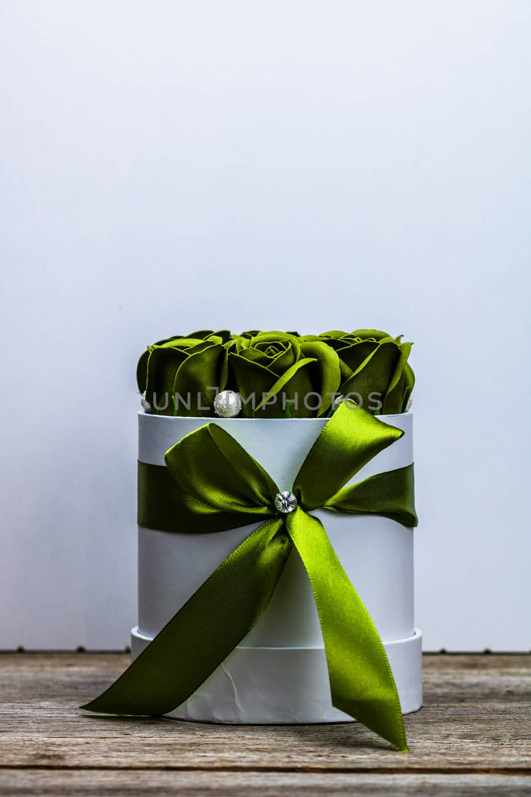 Green roses in a round luxury present box. Bouquet of flowers in by vladispas