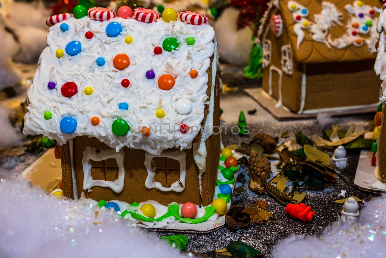 Colorful gingerbread house isolated on blurred background with C by vladispas