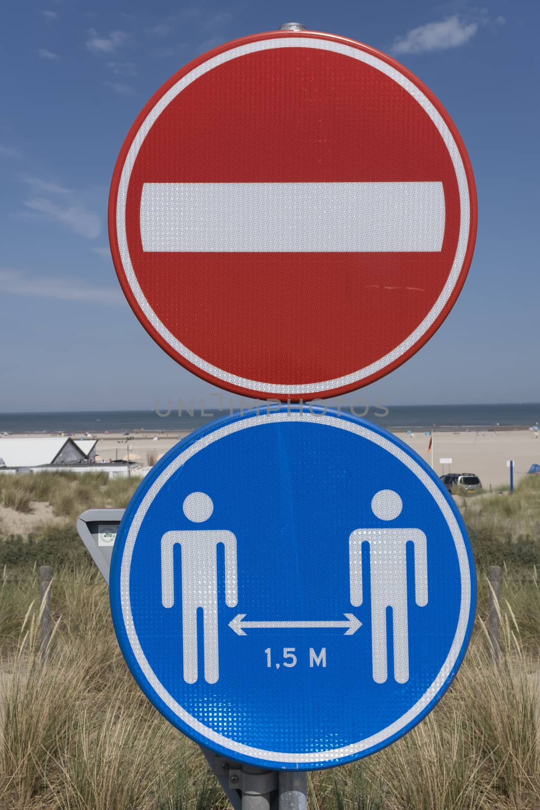 Road sign of social distancing. 1.5 meter distance, together against COVID-19 by Tjeerdkruse