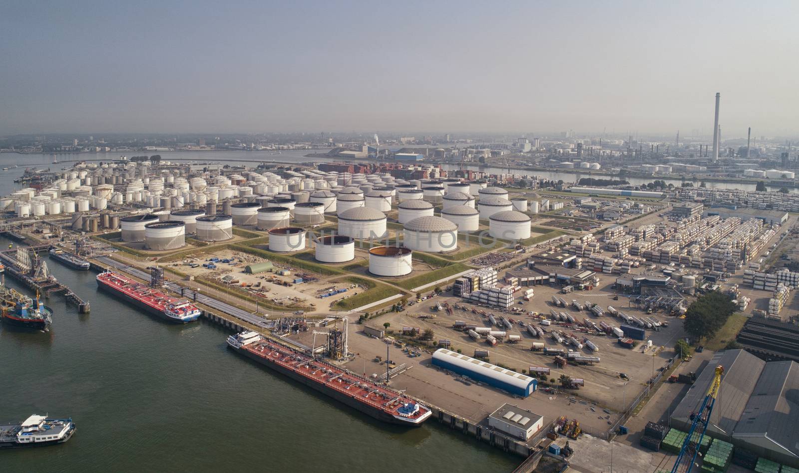 Industrial area in the Port of Rotterdam in The Netherlands by Tjeerdkruse