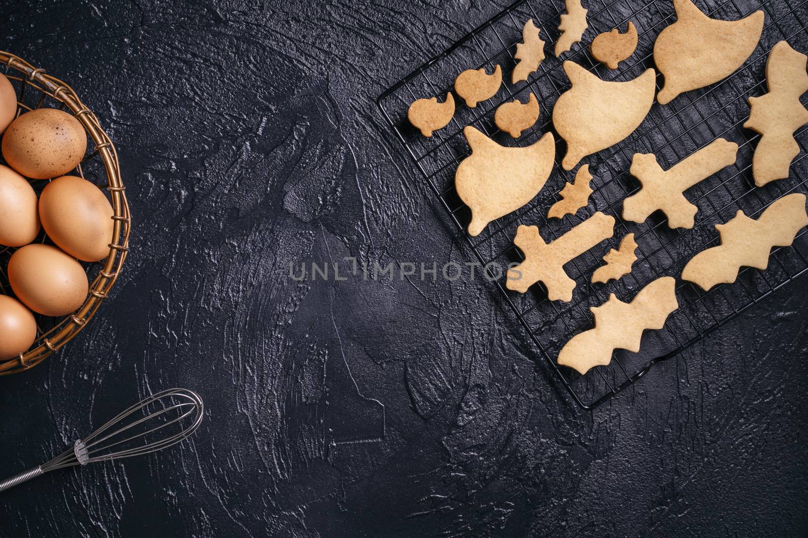 Design concept of making Halloween cookies, baking recipe ingredients layout of preparing party, top view, flat lay, overhead, blank copy space.