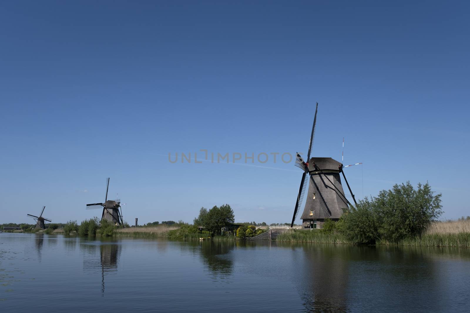 beautiful windmill landscape at kinderdijk in the netherlands by Tjeerdkruse
