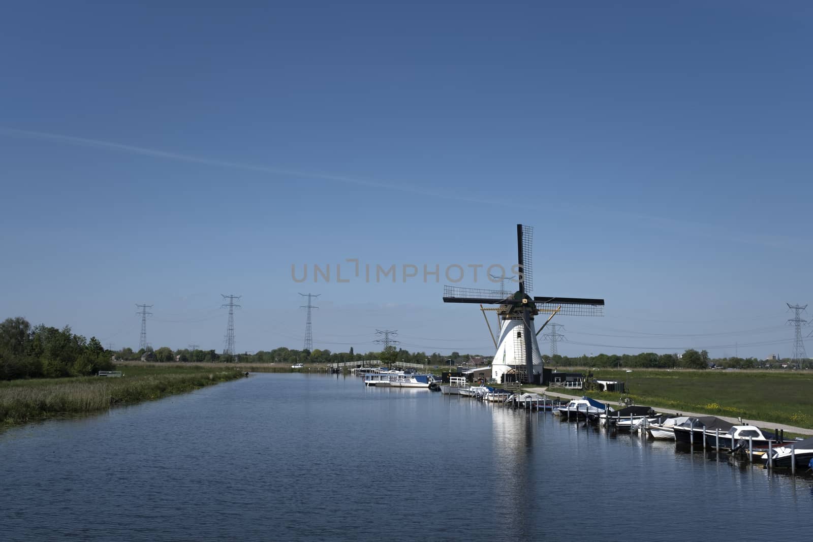 Netherlands rural lanscape with windmills at famous tourist site by Tjeerdkruse
