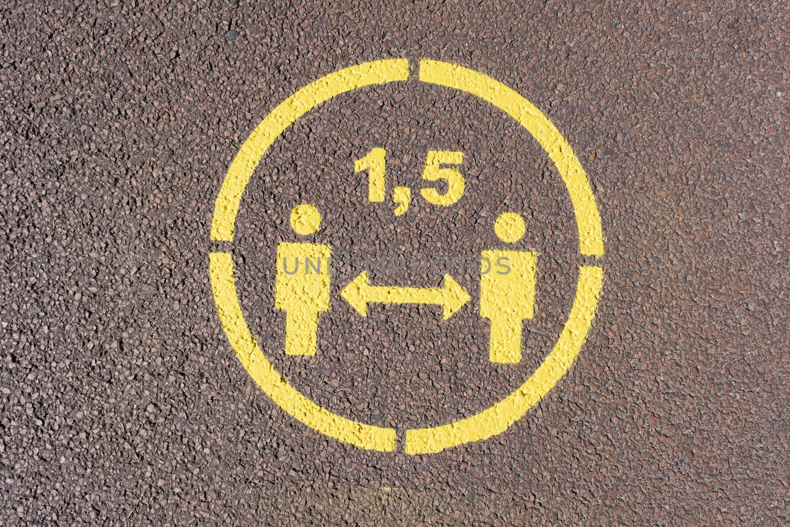Yellow letters in the circle as a sign on the footpath says Stay by Tjeerdkruse