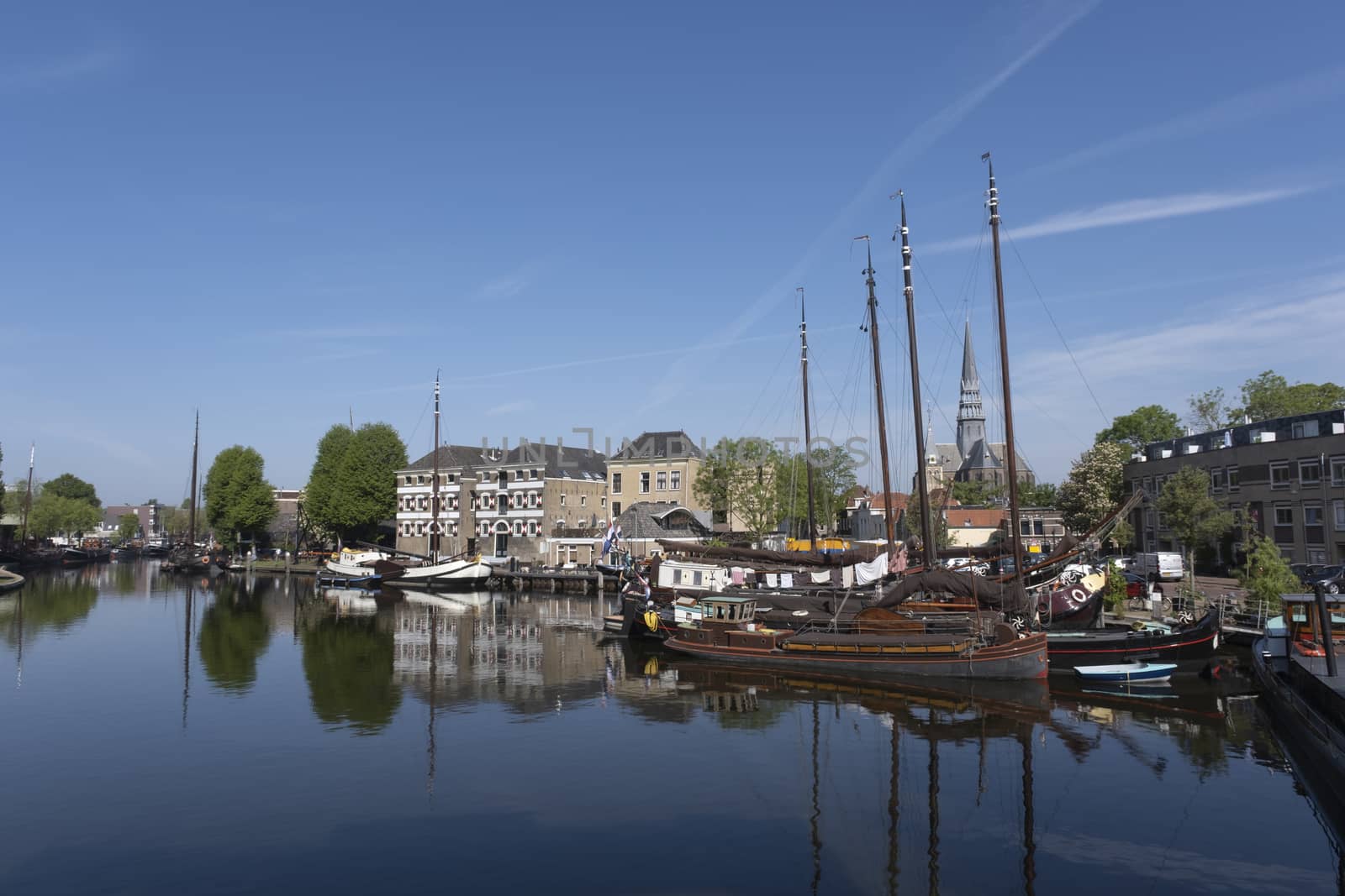 Museum harbor and Turfsingelgracht in Gouda with historic boats, by Tjeerdkruse
