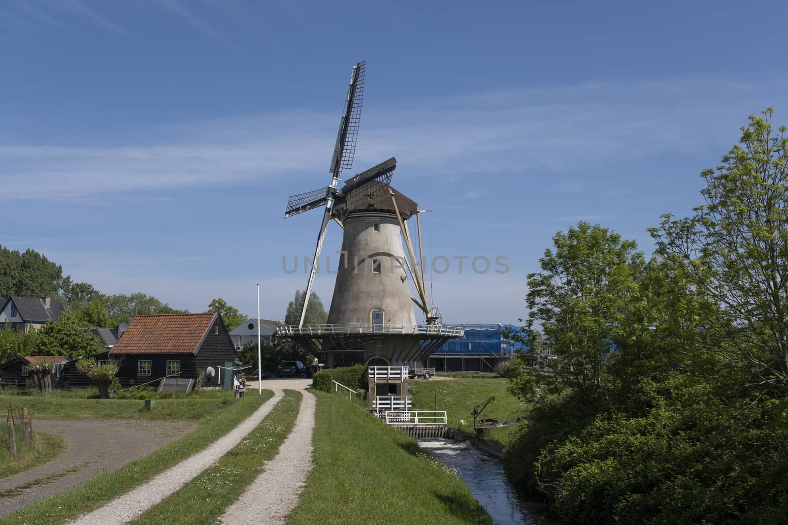 Traditional setting of the historical dutch windmills landscape at the Netherlands, an UNESCO world heritage site in holland
