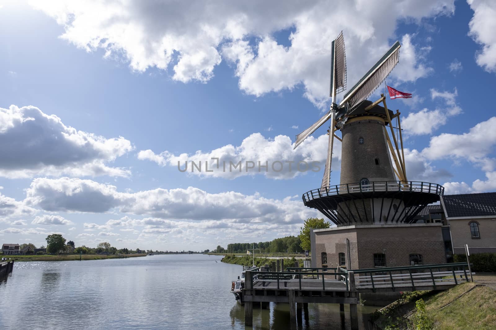 Traditional setting of the historical dutch windmills landscape  by Tjeerdkruse