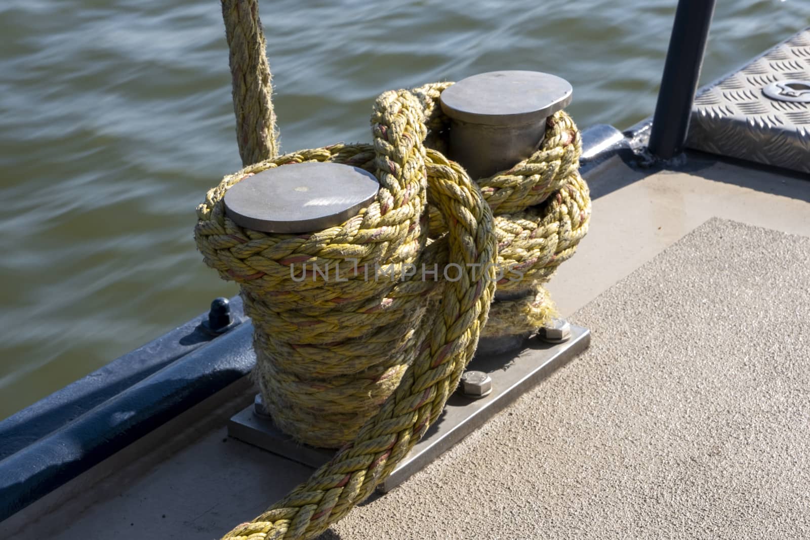 Iron bollard with ship ropes by Tjeerdkruse