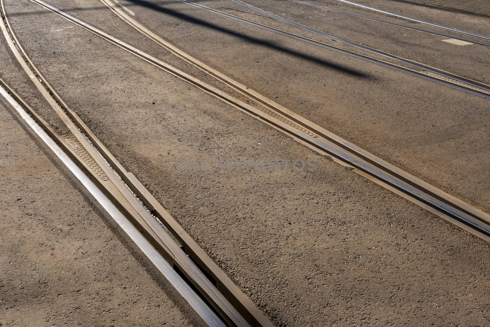 Tram tracks crossing each other. close up by Tjeerdkruse