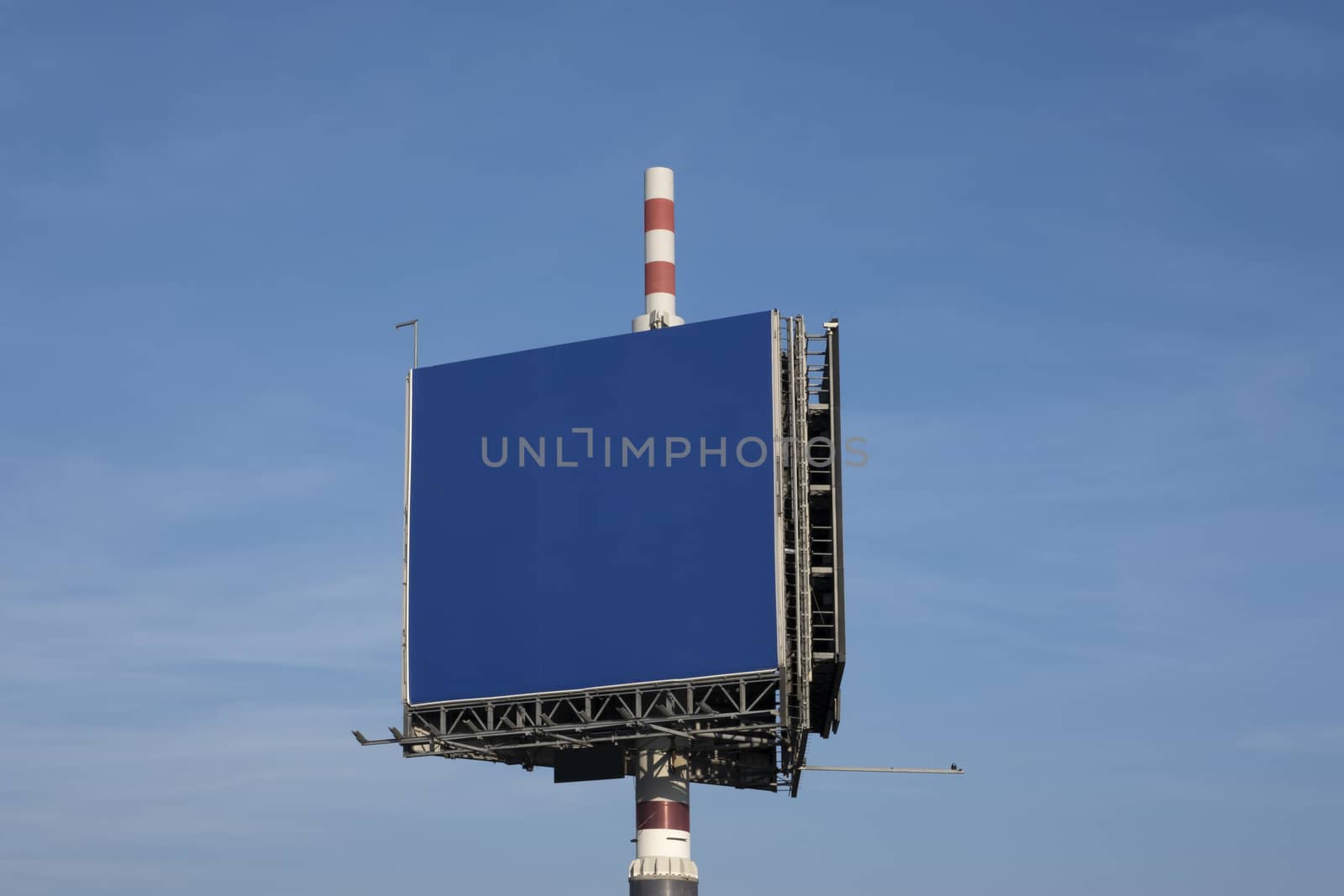 Billboard against clouds and blue sky background. Copy space ban by Tjeerdkruse
