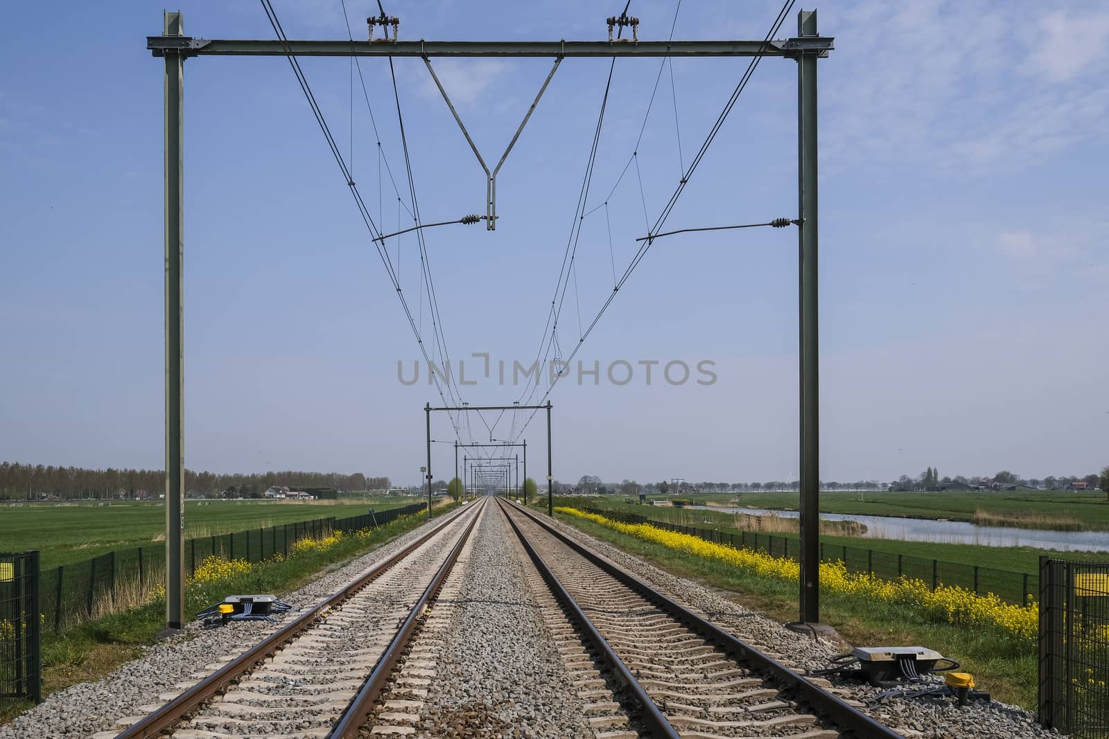 Railroad way going into the distance, The Netherlands by Tjeerdkruse