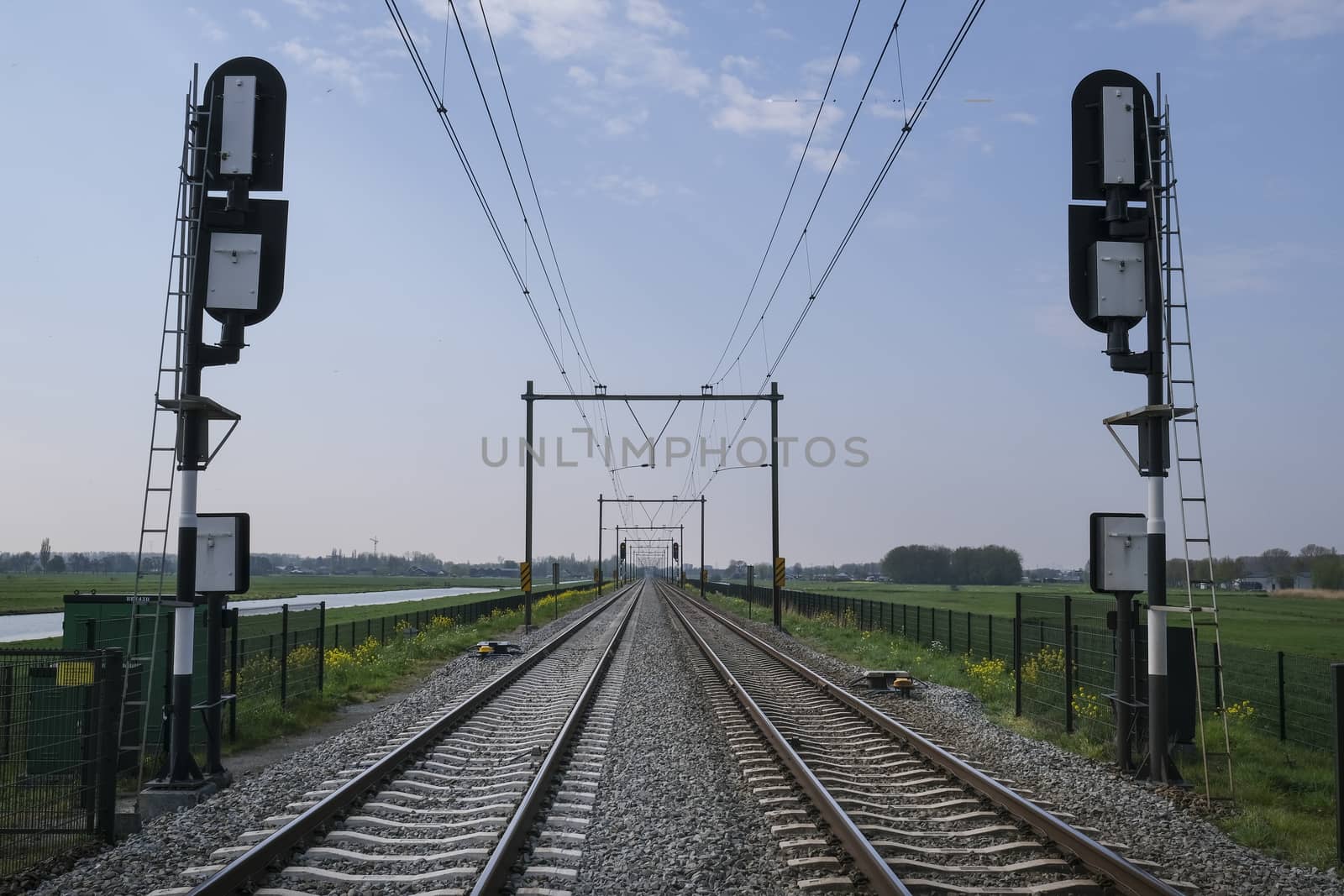 Railroad way going into the distance, The Netherlands by Tjeerdkruse