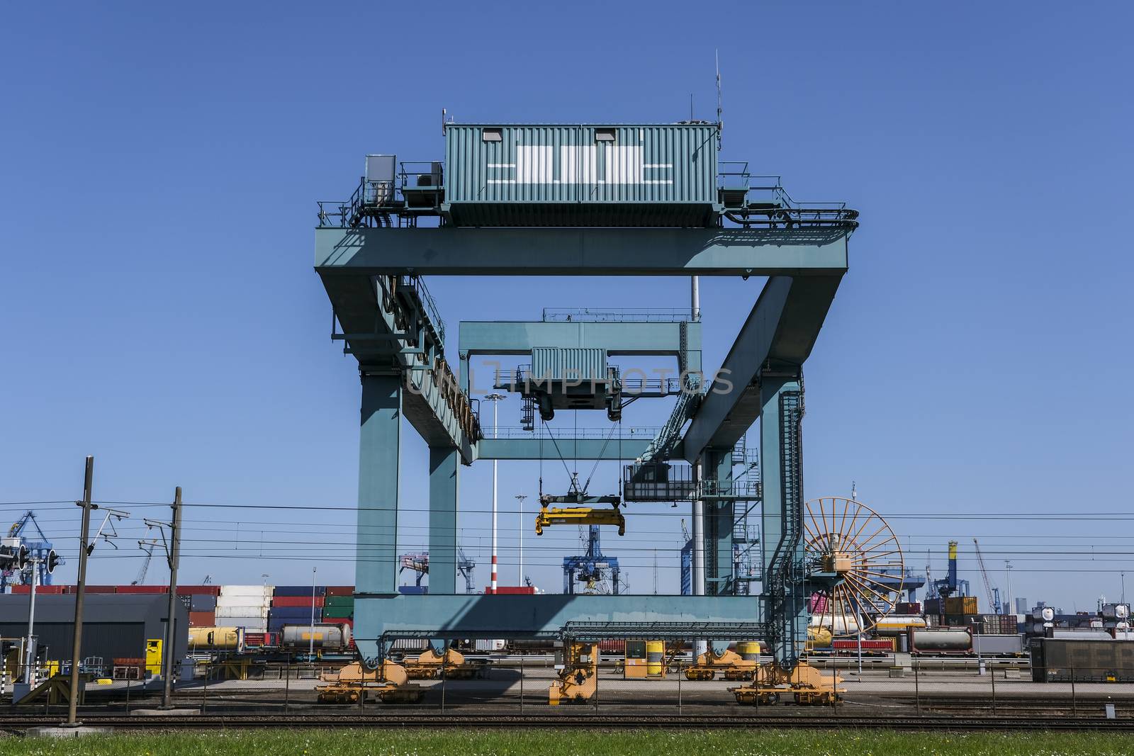 Cargo crane in the Port of Rotterdam. View of container terminal by Tjeerdkruse