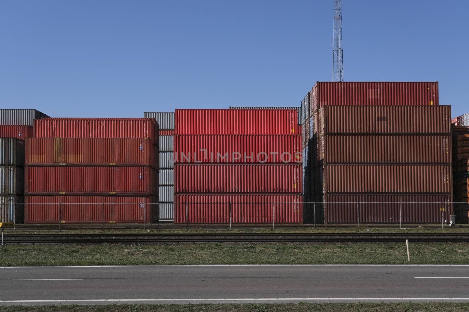 Stack of containers in harbor. industrial background by Tjeerdkruse