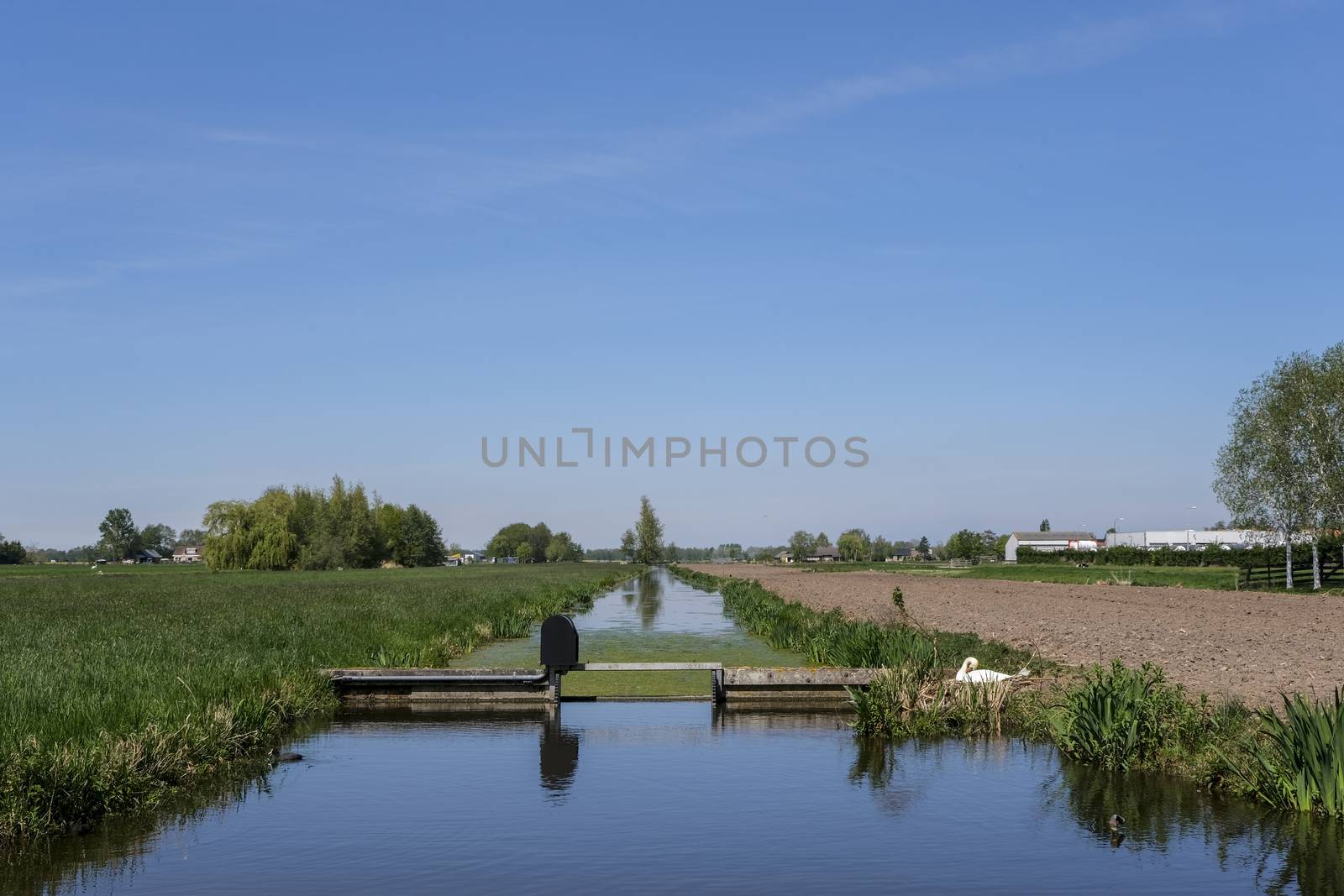 Dutch polder landscape with a water management construction earl by Tjeerdkruse