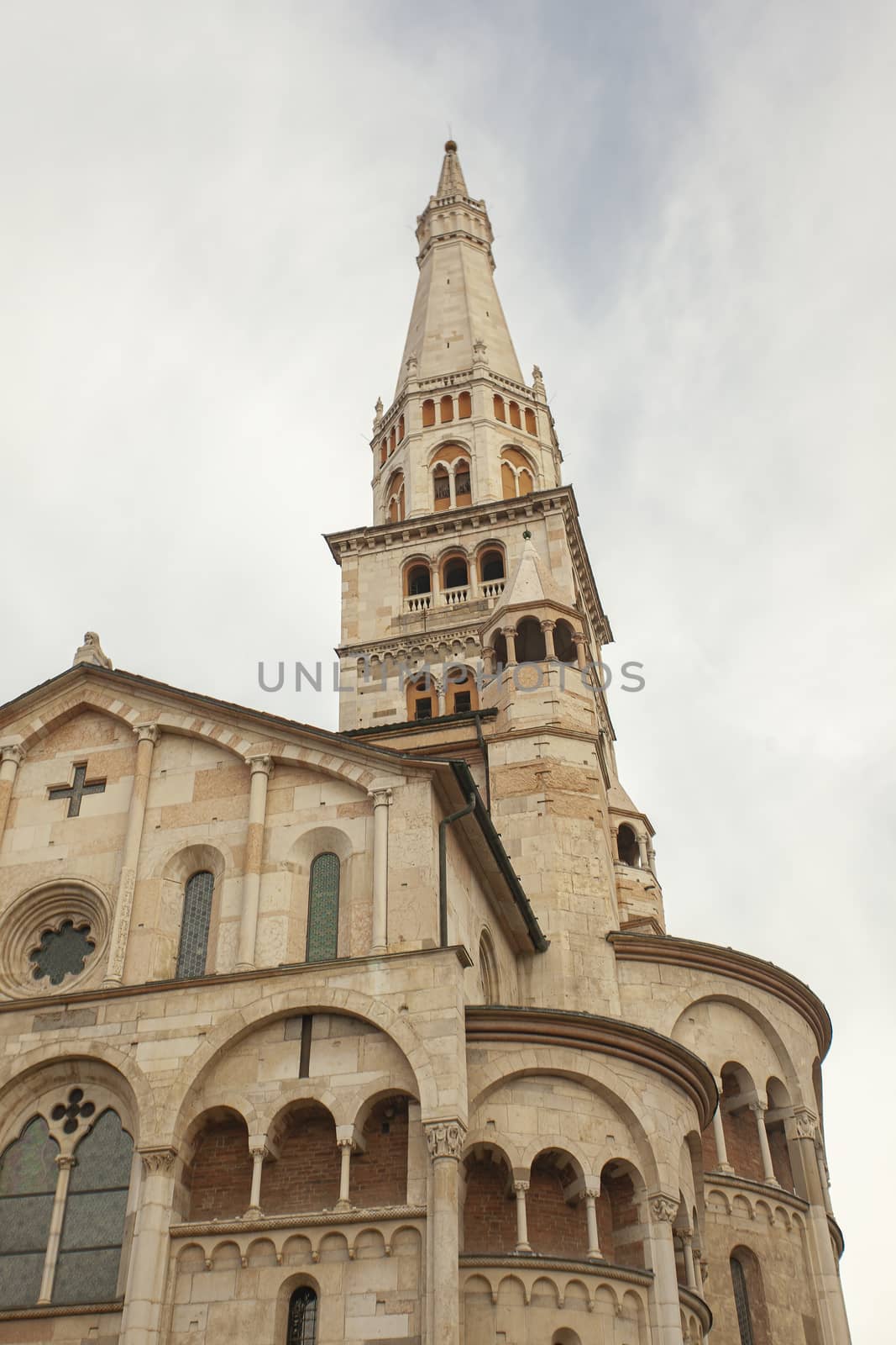 Ghirlandina ancient tower and duomo from below in Modena city, Italy