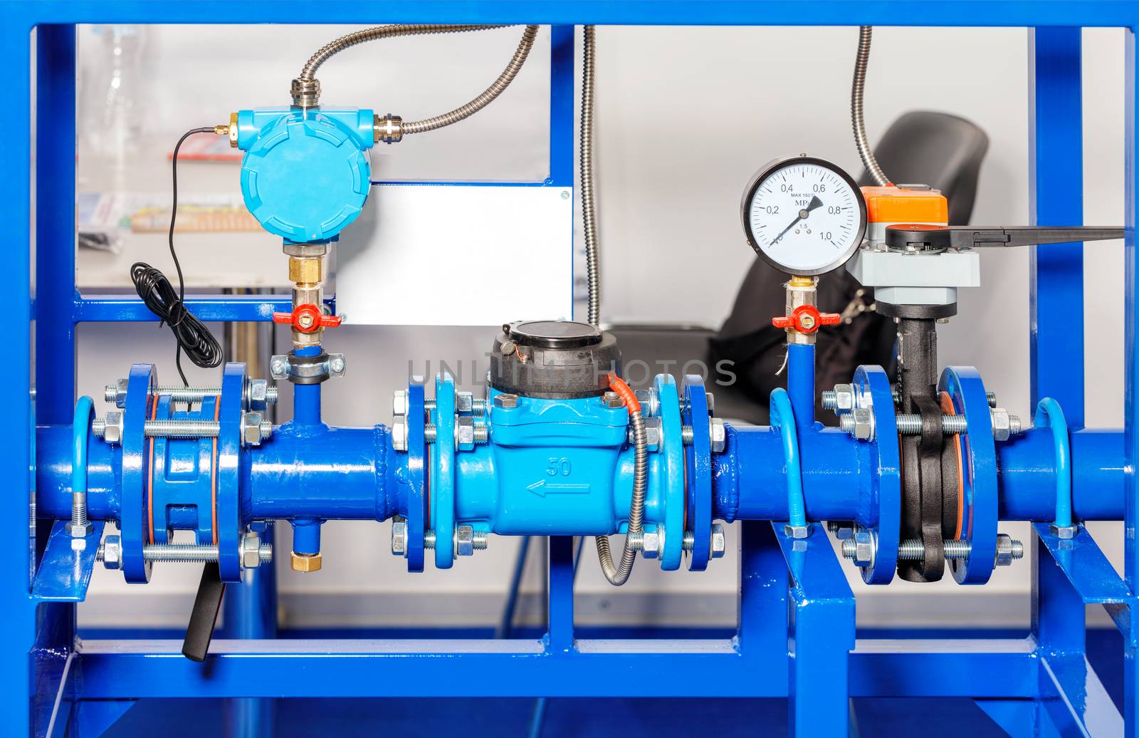 Installation of the water metering and pressure system assembly, close-up of manometers, pipes and taps, copy space.
