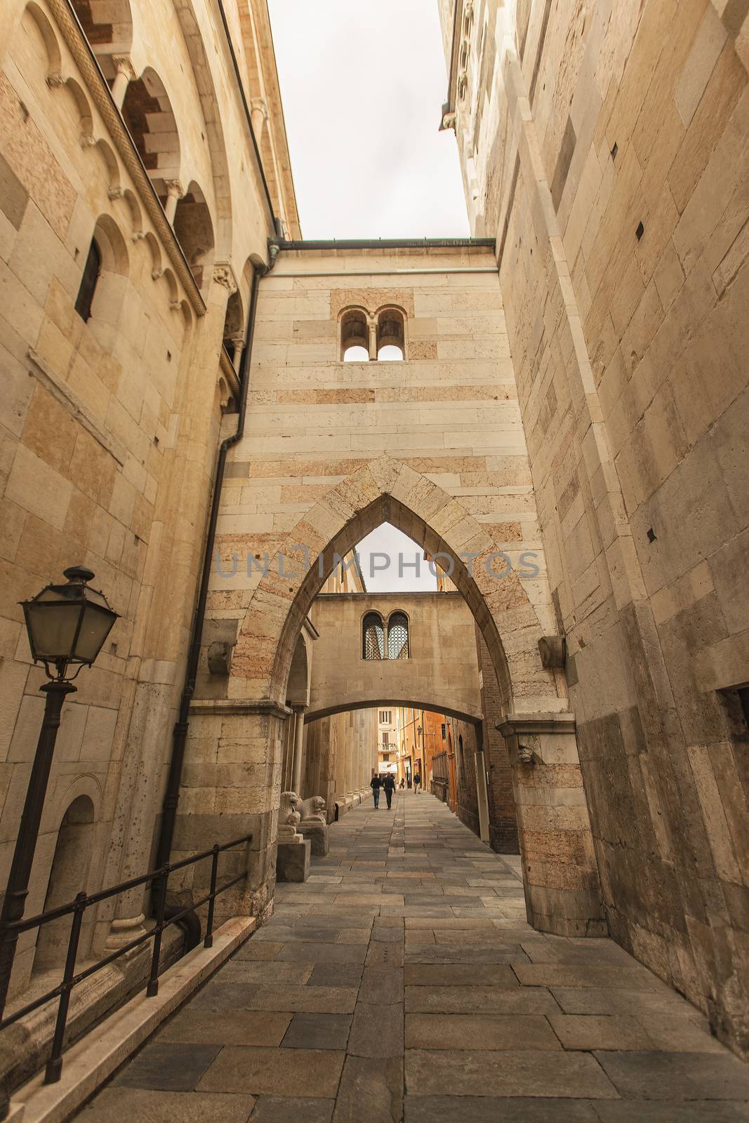 Arcades in the alley adjacent to the Modena Cathedral in Italy