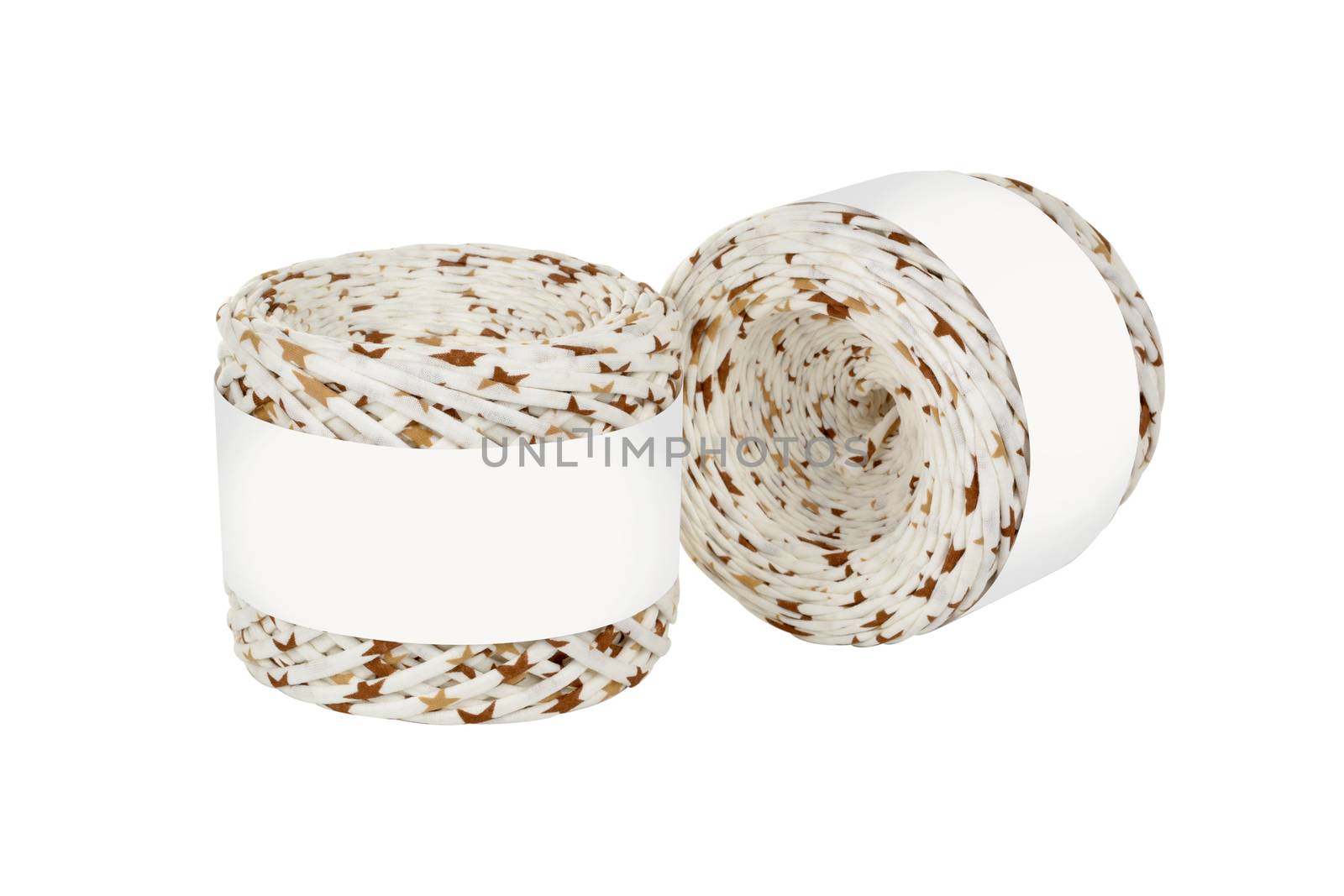 Two skeins of beige color elastic knitted cotton yarn for crochet. Roll with mockup label layout on white background. Use for handwork, creating wicker baskets and home accessories.