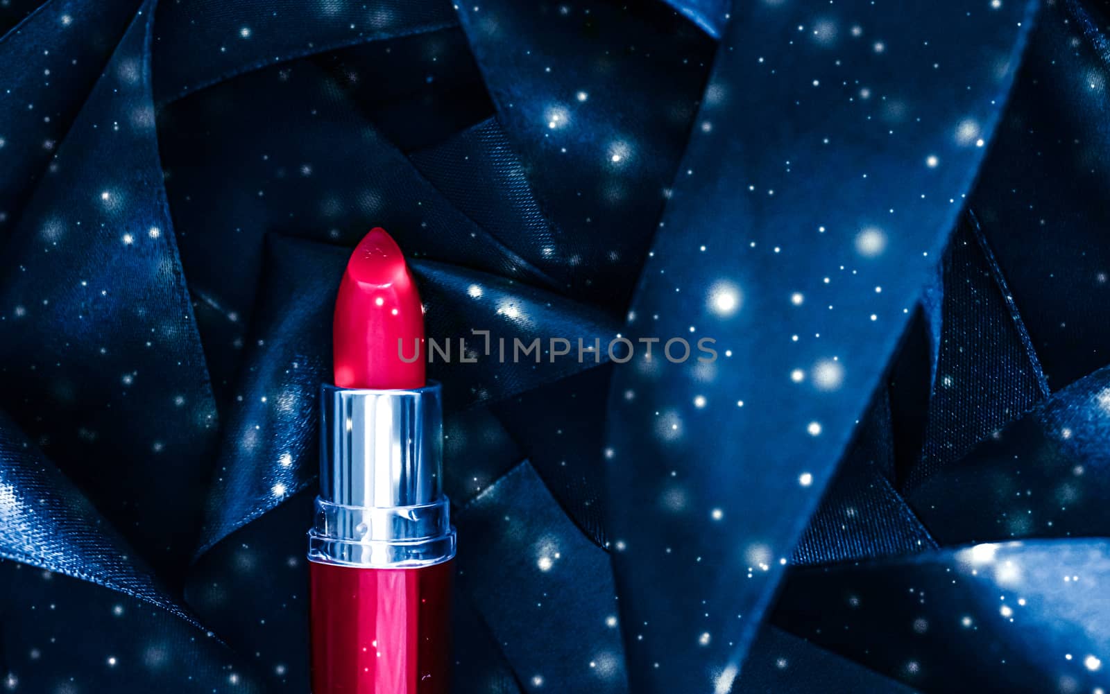 Red lipstick on blue silk and shiny glitter background, luxury make-up and beauty cosmetic by Anneleven