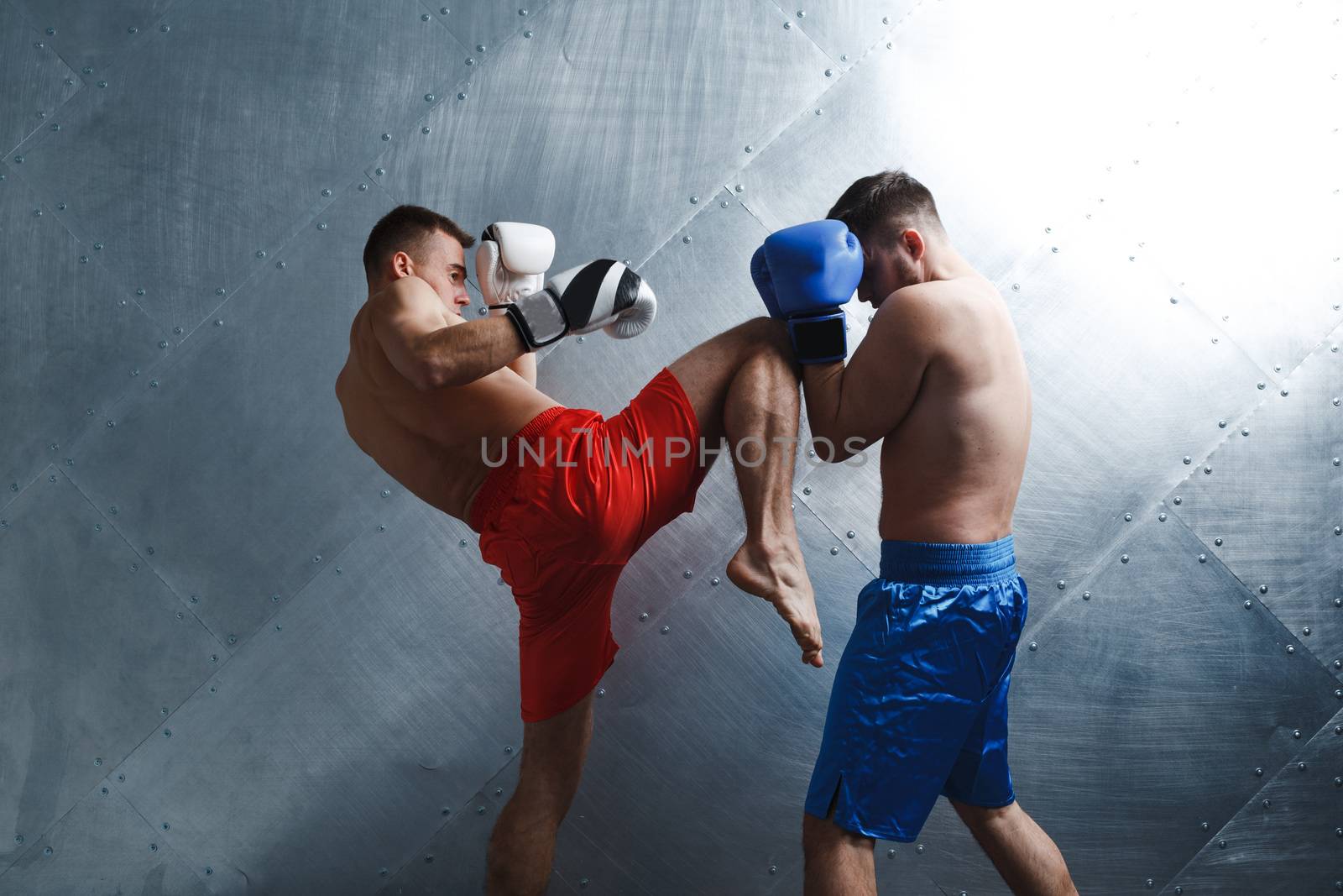 Two men boxers fighting muay thai boxing by primipil