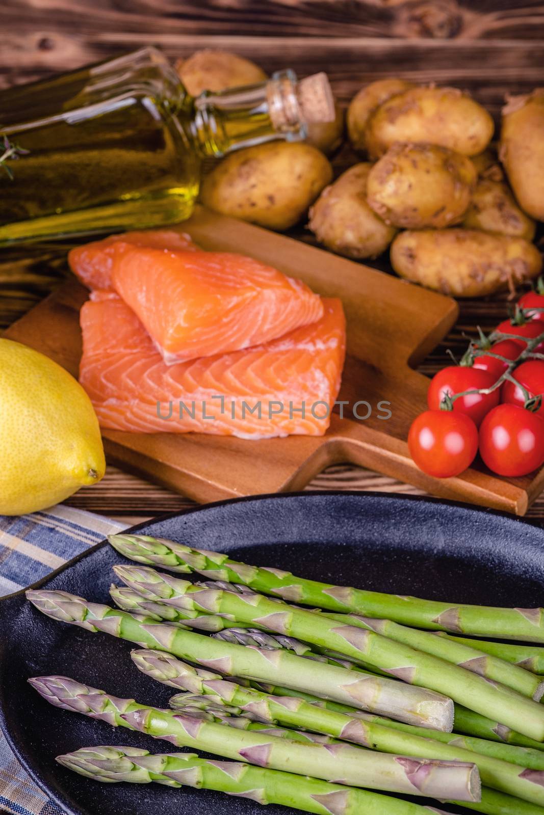 Set of fresh products for healthy food on wooden table by Fischeron