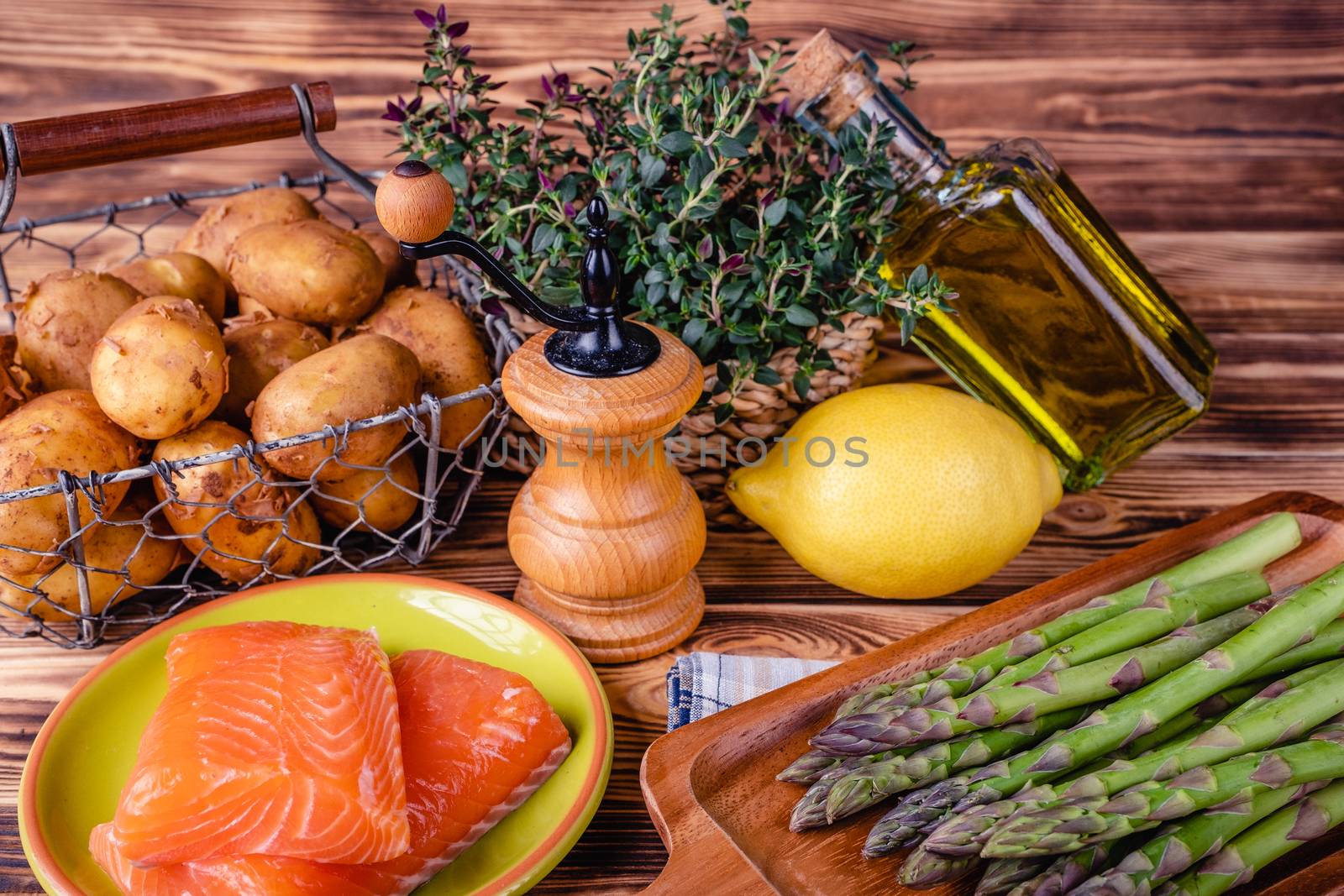 Set of fresh products for healthy food on wooden table by Fischeron