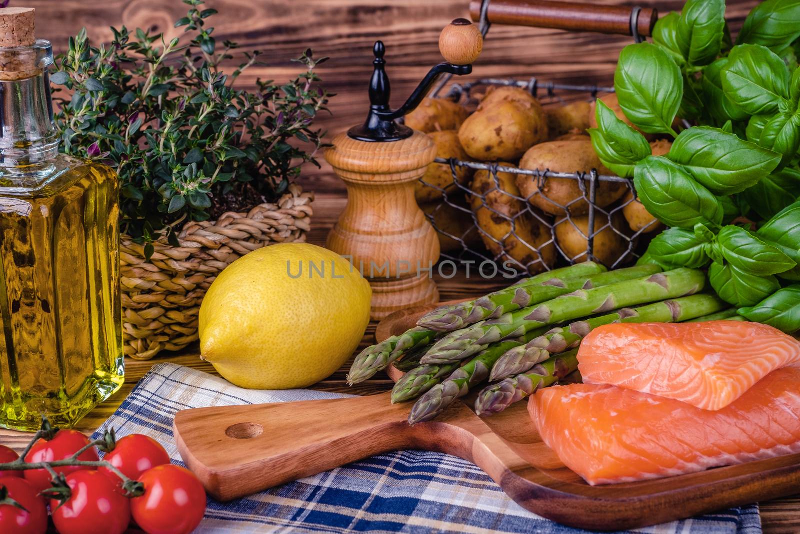 Set of fresh products for healthy food on wooden table by Fischeron