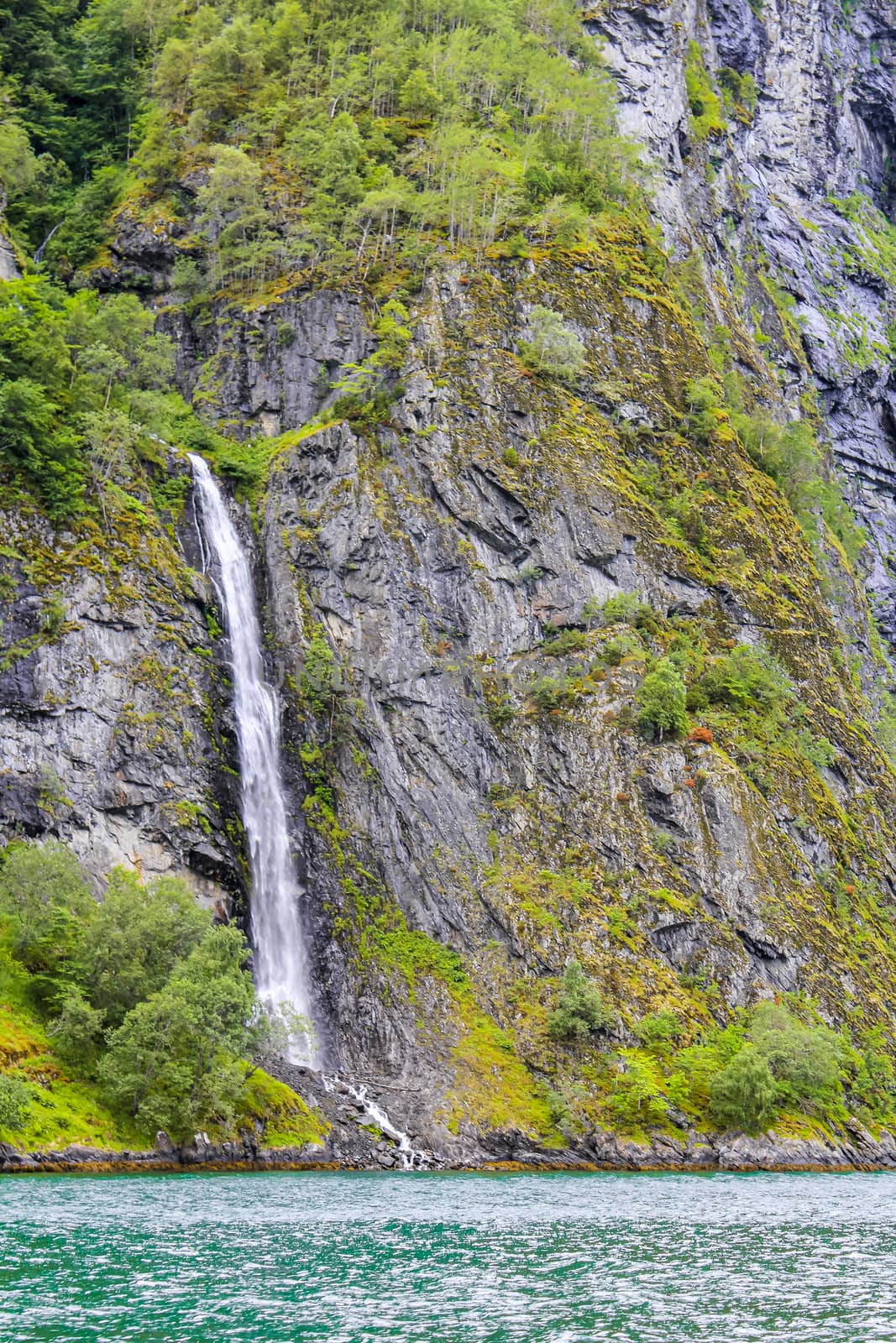 Waterfall in Aurlandsfjord Aurland Sognefjord in Norway. by Arkadij