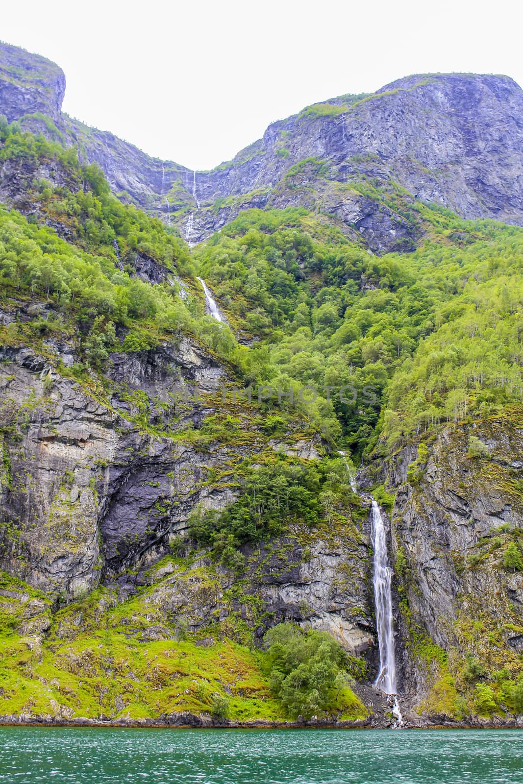 Waterfall in Aurlandsfjord Aurland Sognefjord in Norway. by Arkadij