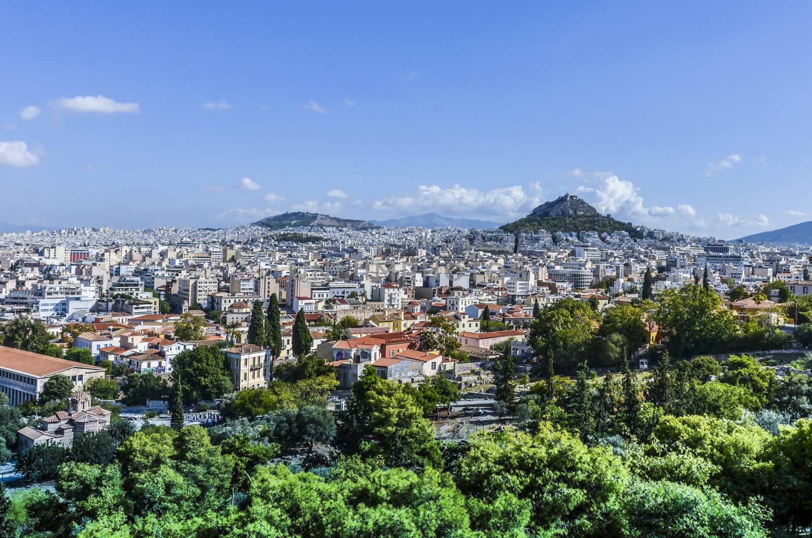 Panoramic view of the city of Athens from the hill of Philopappos in which Mount Lycabettus stands the tallest of Athens