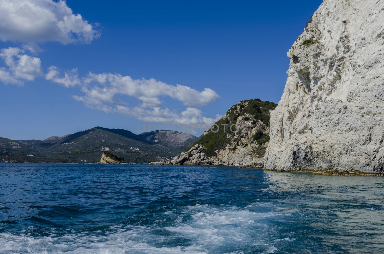 view of the island of zakynthos from the sea with its mountains its vegetation and its reefs