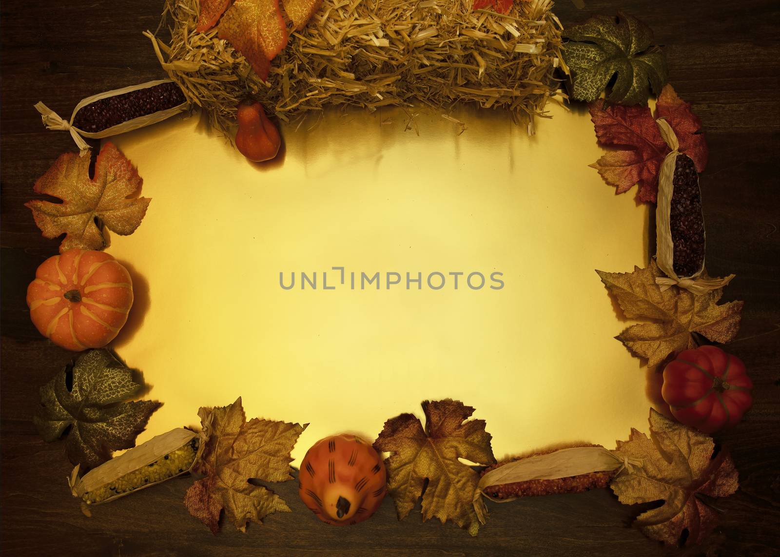 Flat lay frame formed by fall harvest items with gold center.