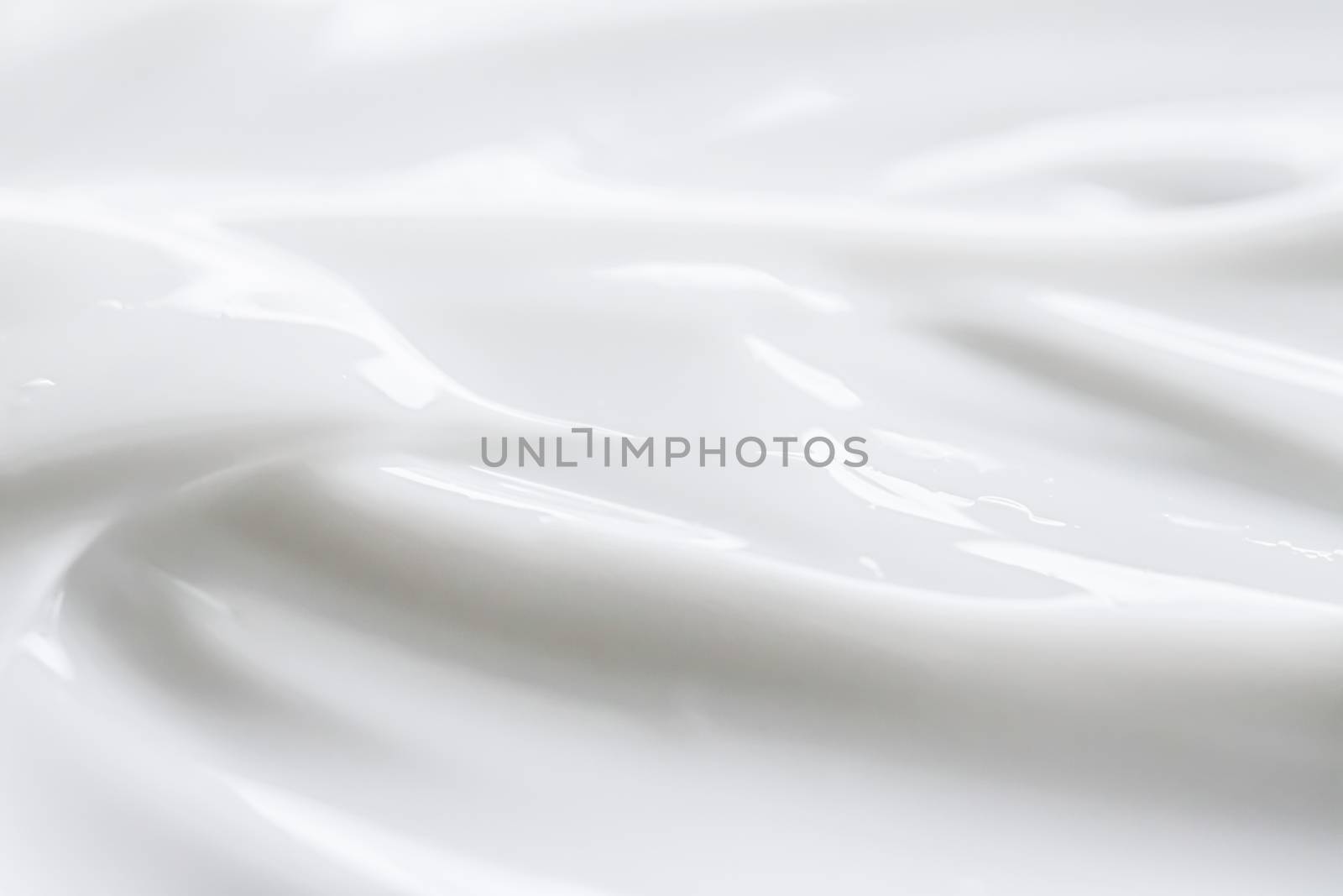 Pure white cream texture as abstract background, food substance or organic cosmetics