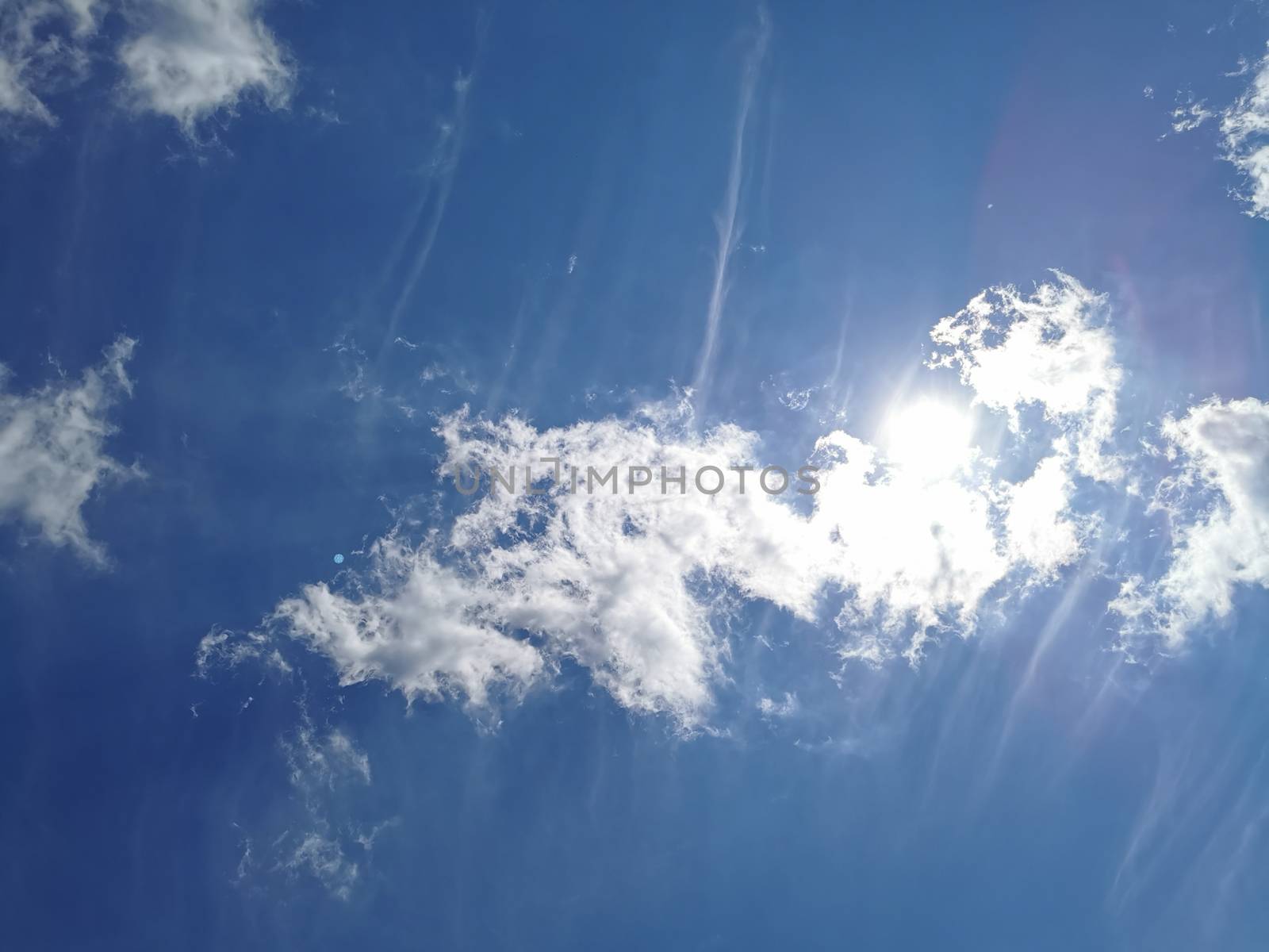 Clouds with blue a dark blue sky with copy space by PeterHofstetter